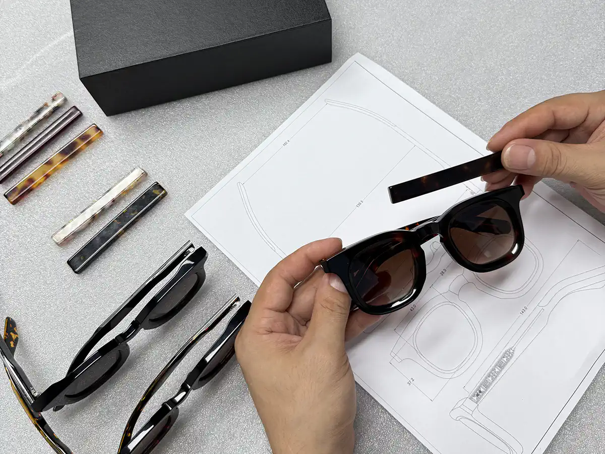 Acetate material color sample compared with a sunglasses frame and technical drawing
