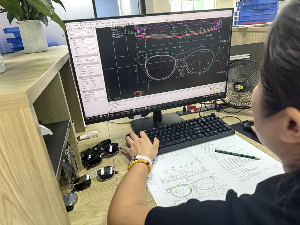 SEESUN custom eyewear manufacturer reviewing CAD drawings and frame samples during product development