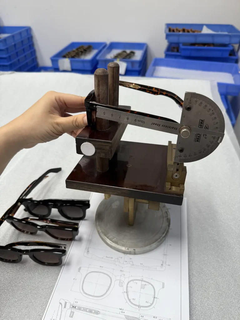 Eyeglasses Factory Eyewear frame checked with a measurement fixture against a technical drawing