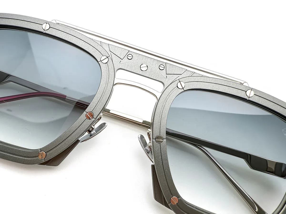 Metal sunglasses with multi-part front construction and visible fasteners
