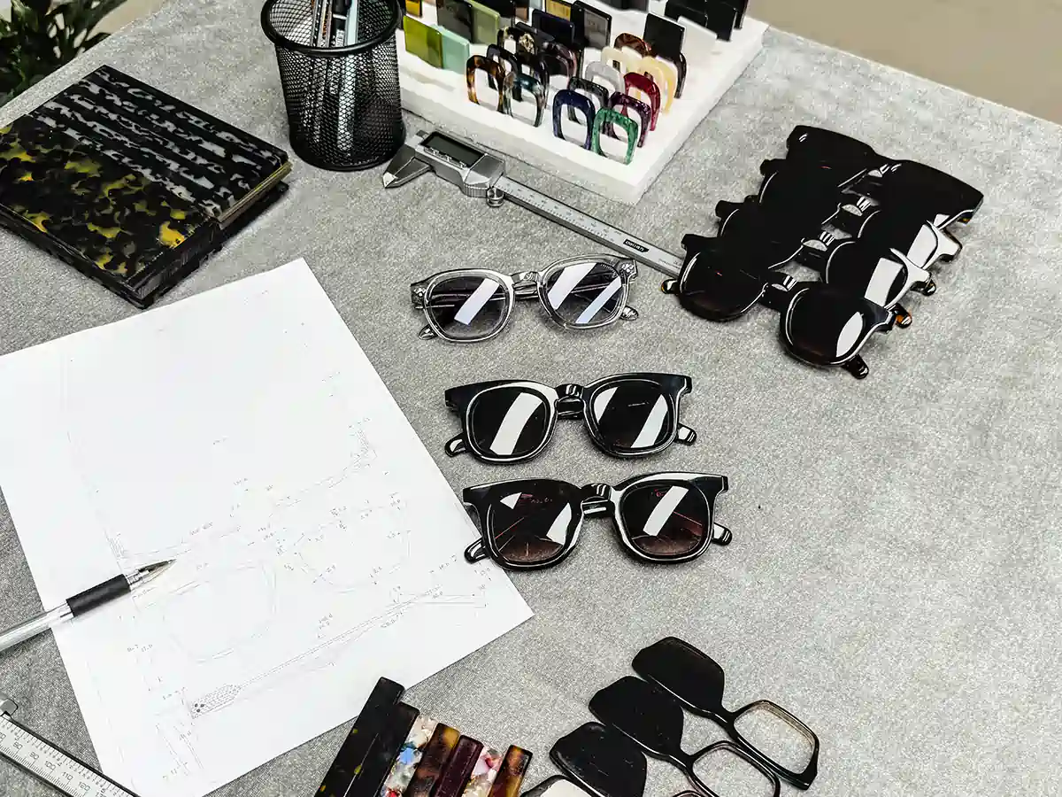 Eyewear samples, frame drawings and material references arranged for product review at SEESUN