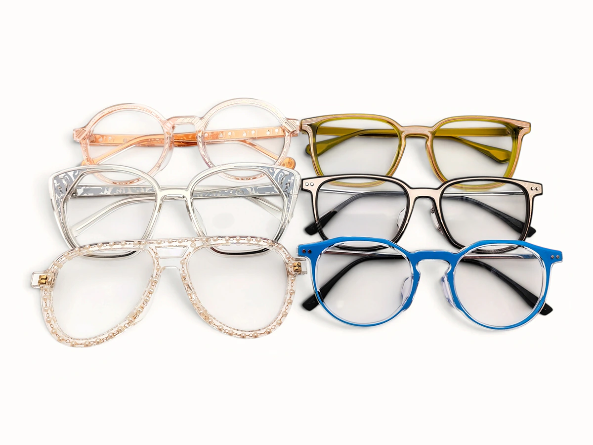 Six custom glasses frames in varied shapes, colors and transparent finishes