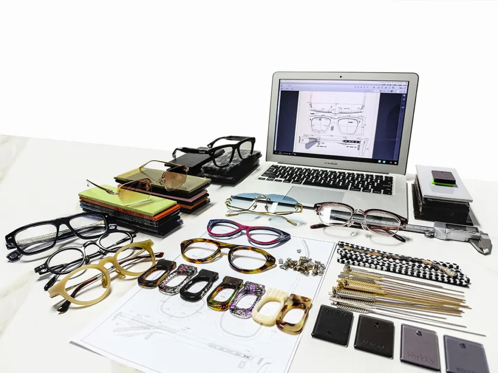 Technical drawings, frame samples, material references and components arranged for project review by an OEM eyewear manufacturer